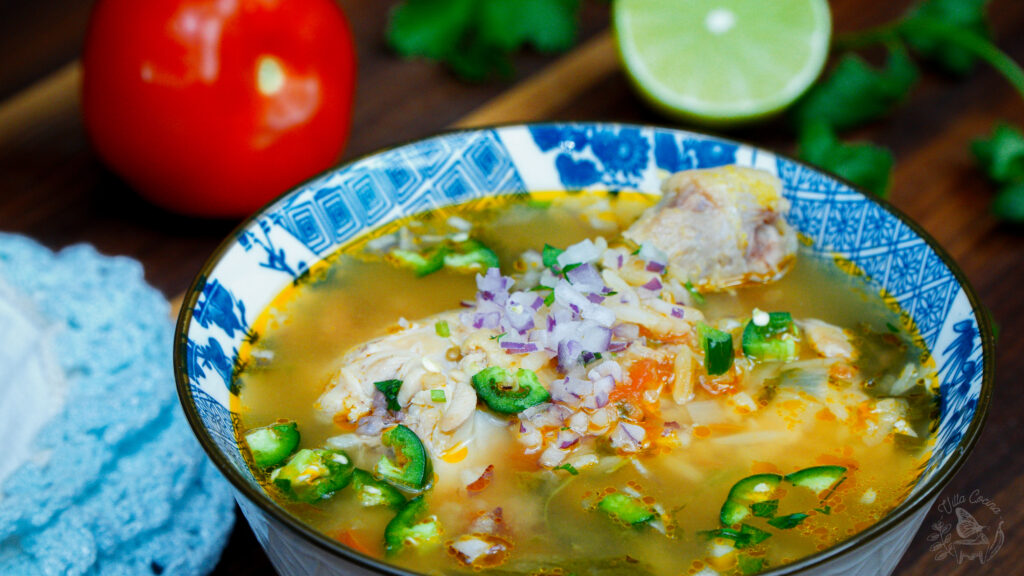 a bowl of chicken soup you can add salsa macha to.