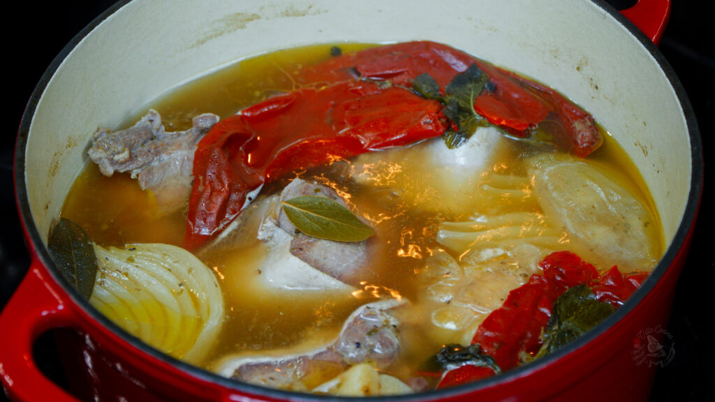 beef tongue cooking in a broth