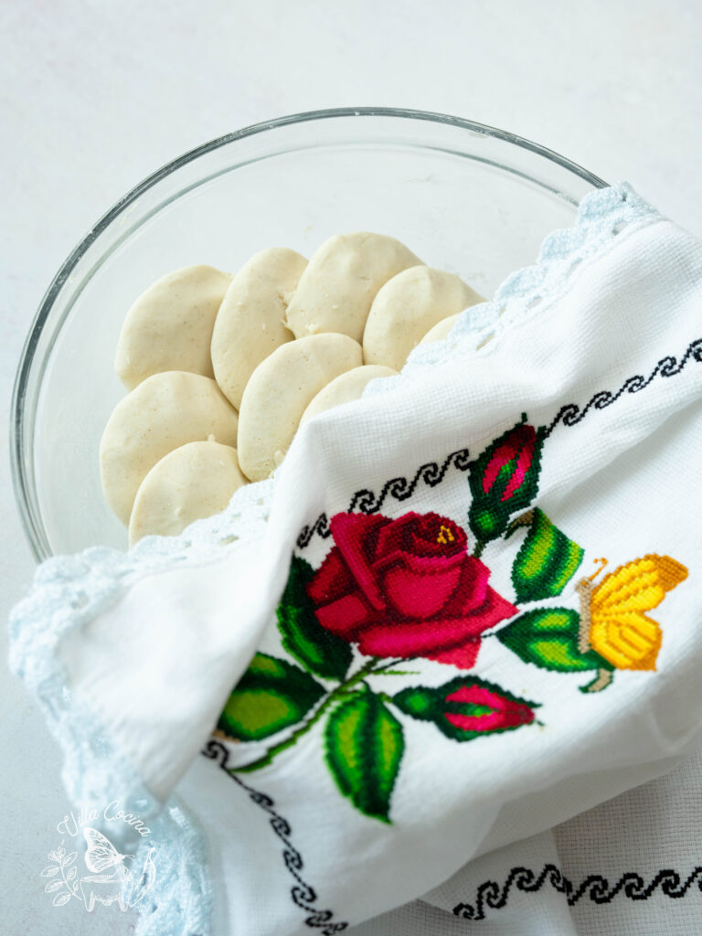 Masa covered with a traditional Mexican kitchen towel