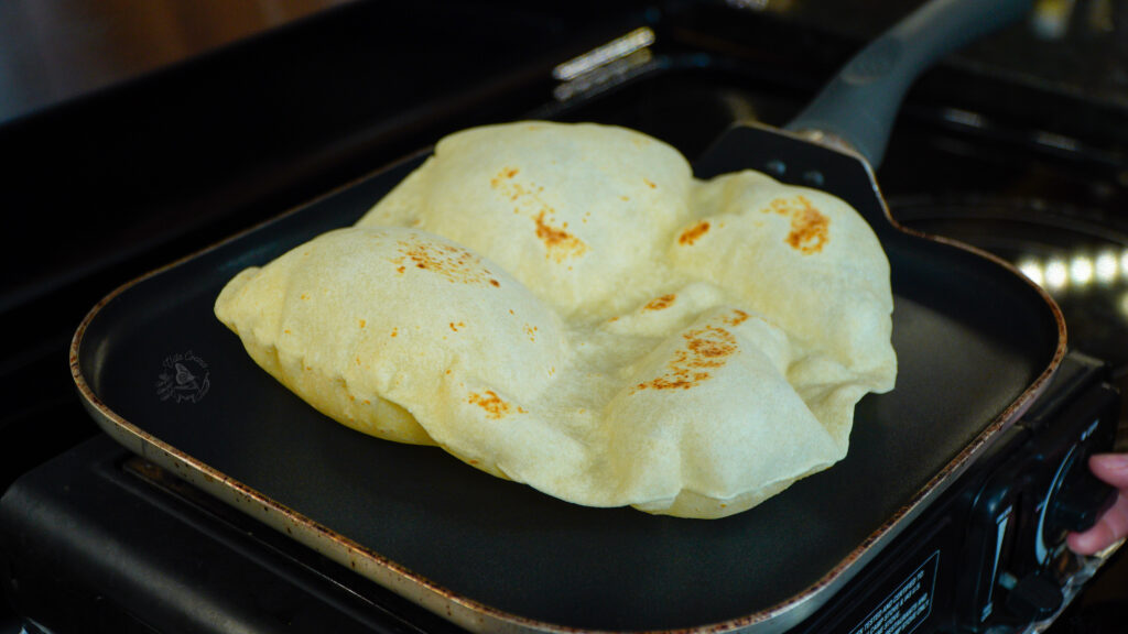 Flour tortilla being cooked