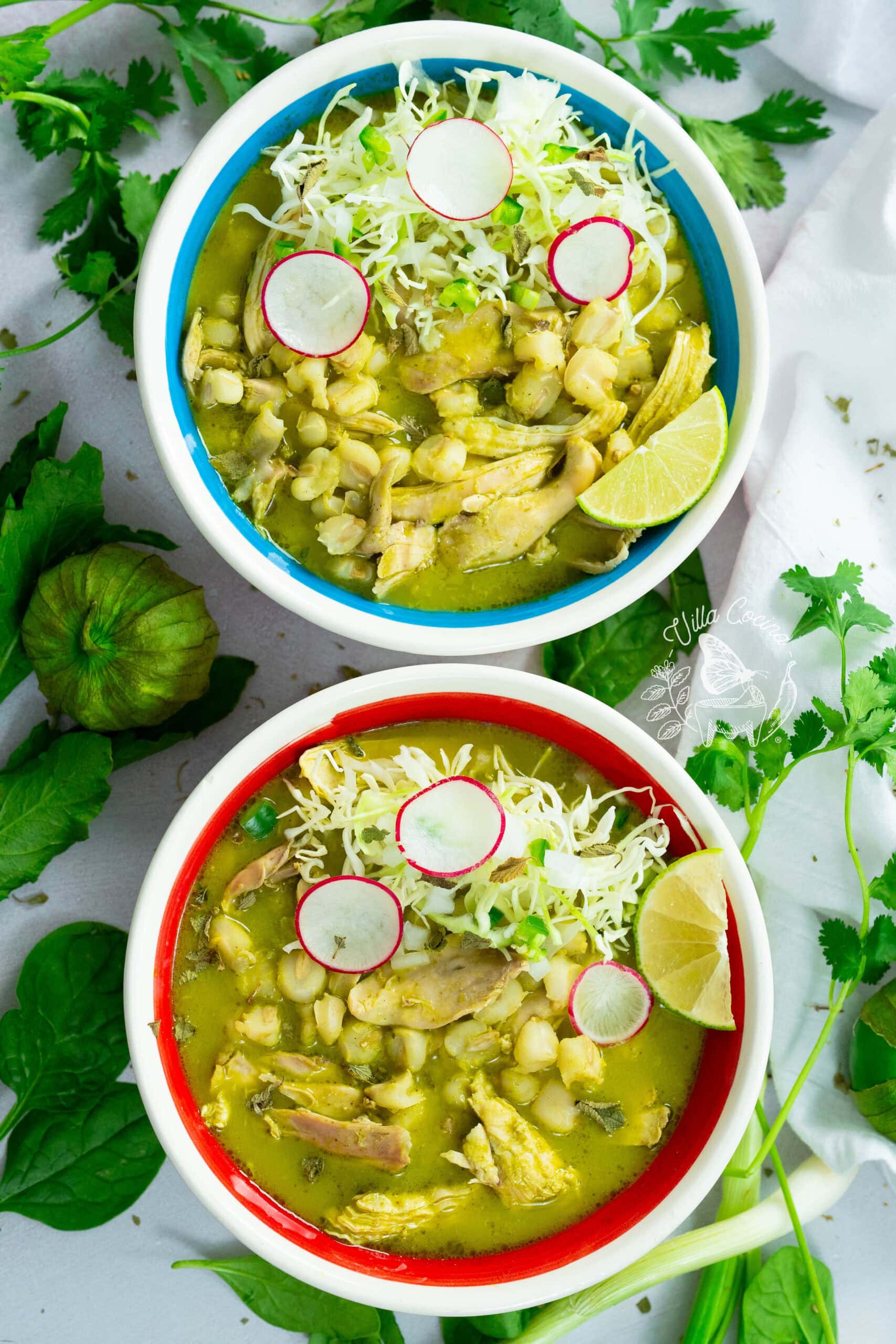 Plated green chicken pozole with toppings. 