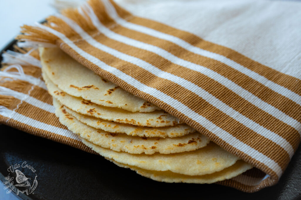 Almond flour tortillas wrapped with a kitchen towel