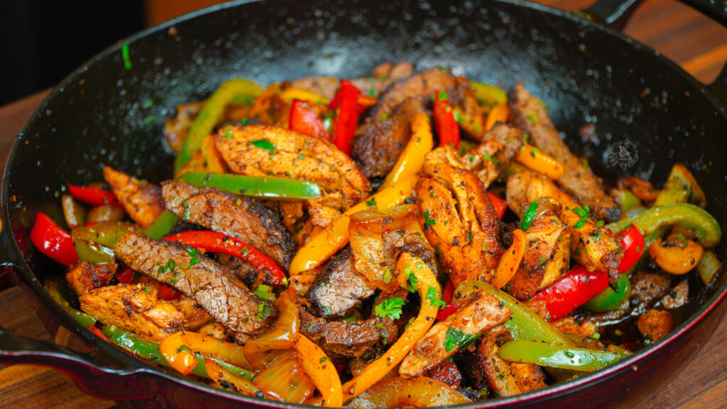 Cooked chicken and steak fajitas