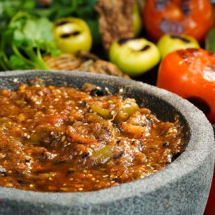 Authentic Mexican salsa with chipotle in a molcajete