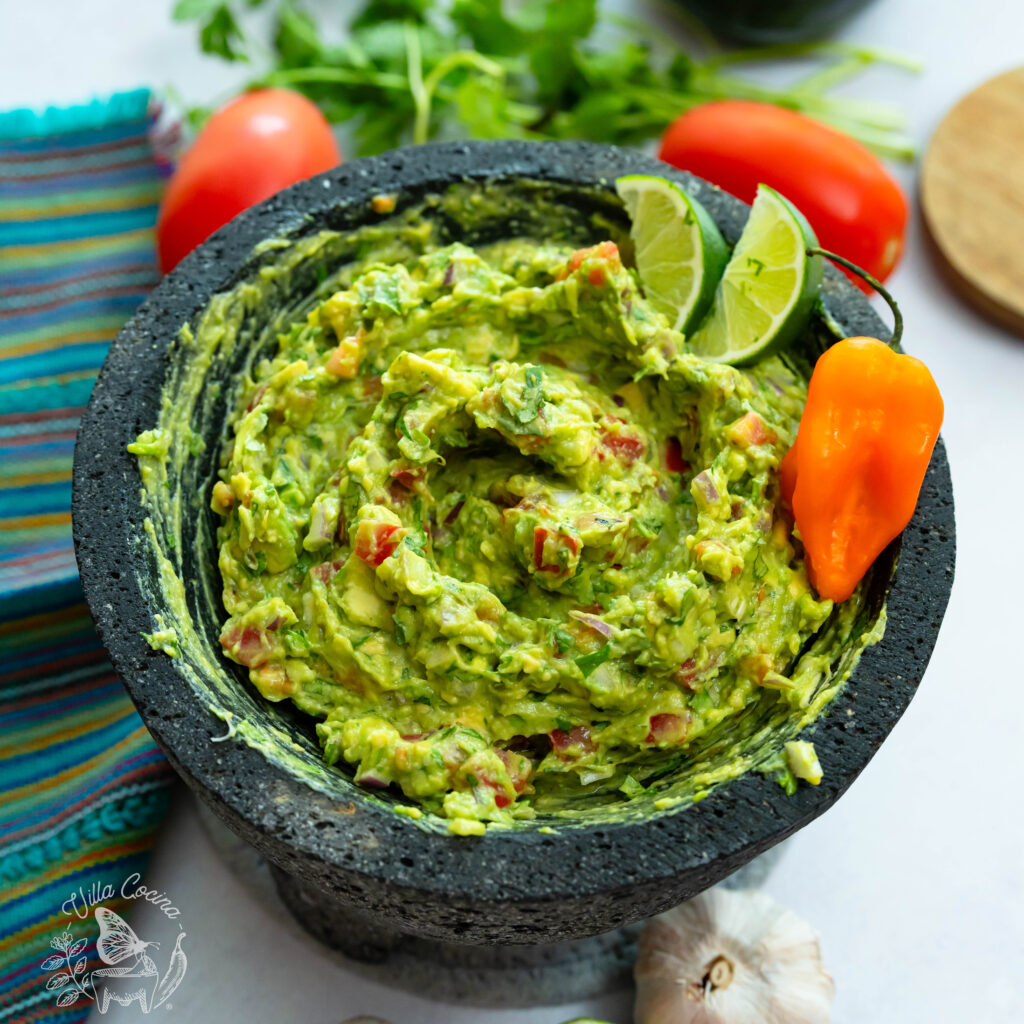 Roasted garlic guacamole with habanero in a molcajete