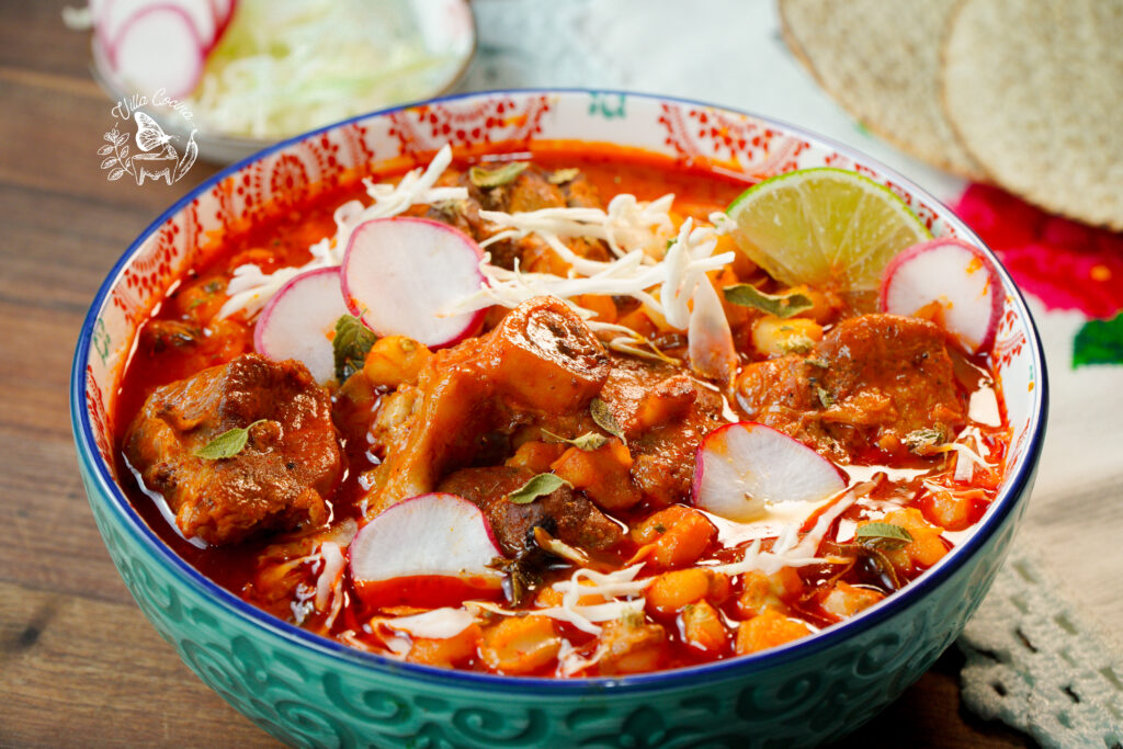 Enjoy a bowl of authentic pozole Rojo. This is a traditional Mexican soup mainly used for celebrations. It is a combination of your choice of meat, hominy and favorite toppings.