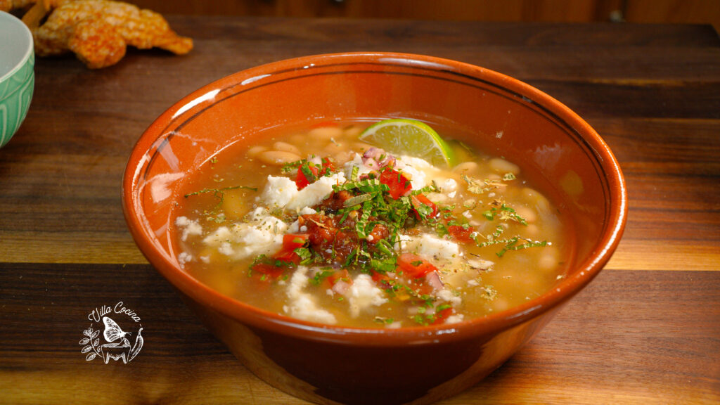 Beans topped with pico de Gallo and cilantro