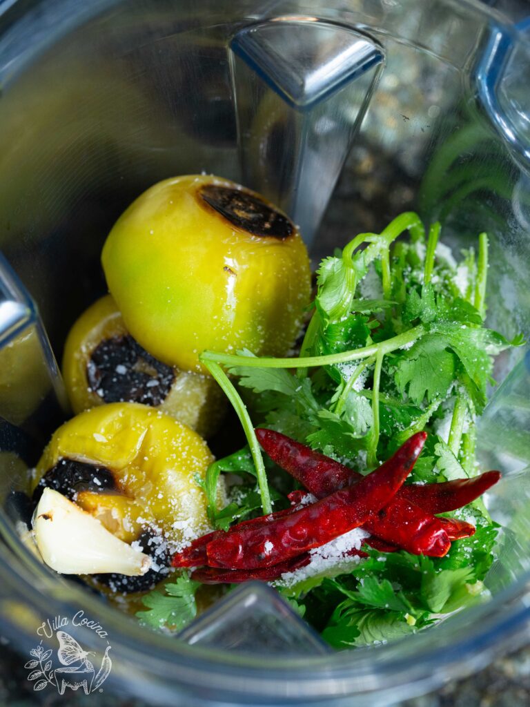 ingredients in a blender ready to make into salsa.