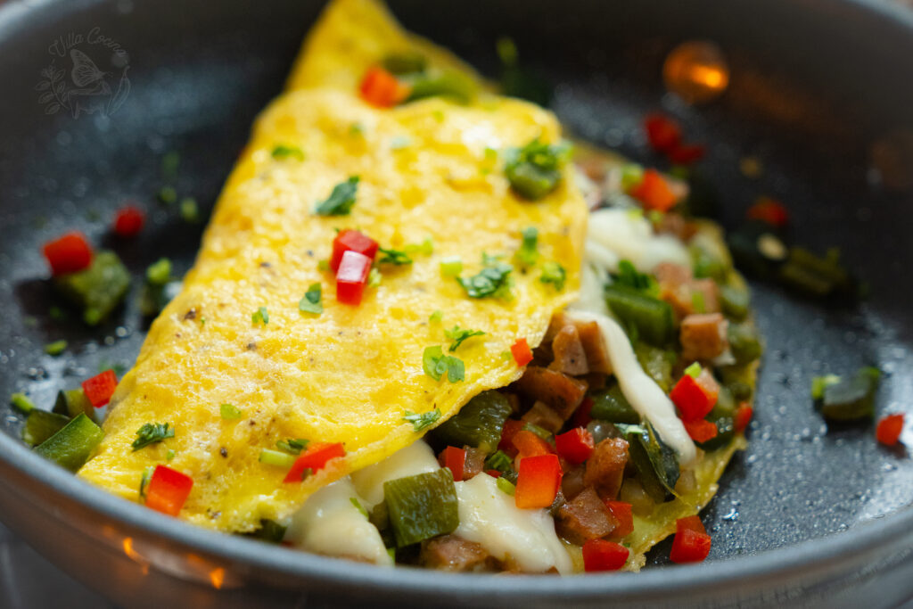 an easy roasted poblano breakfast omelette ready to be served