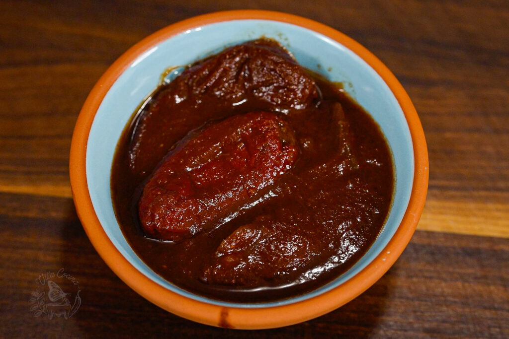 a pinch bowl with chipotles in adobo. 