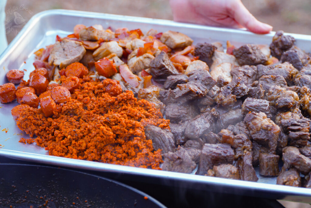 Already cooked different types of meat for a Discada recipe.