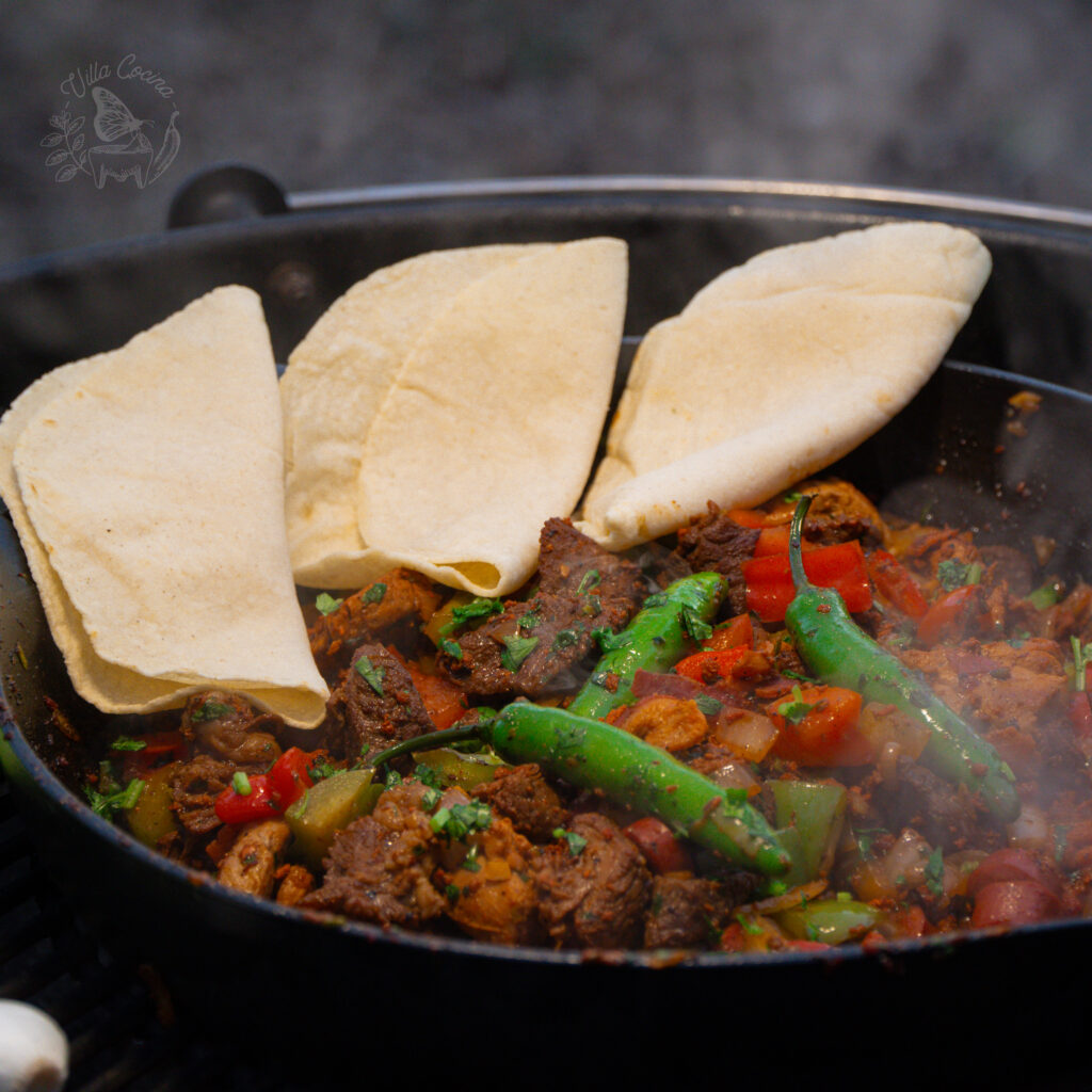 A discada recipe with freshly made corn tortillas. ready to be served as tacos.