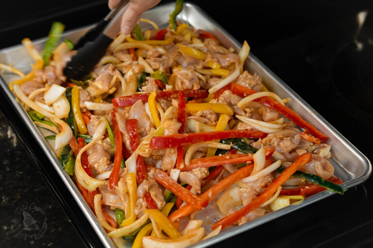 a preheated sheet pan allows for the chicken fajitas to cook more evenly