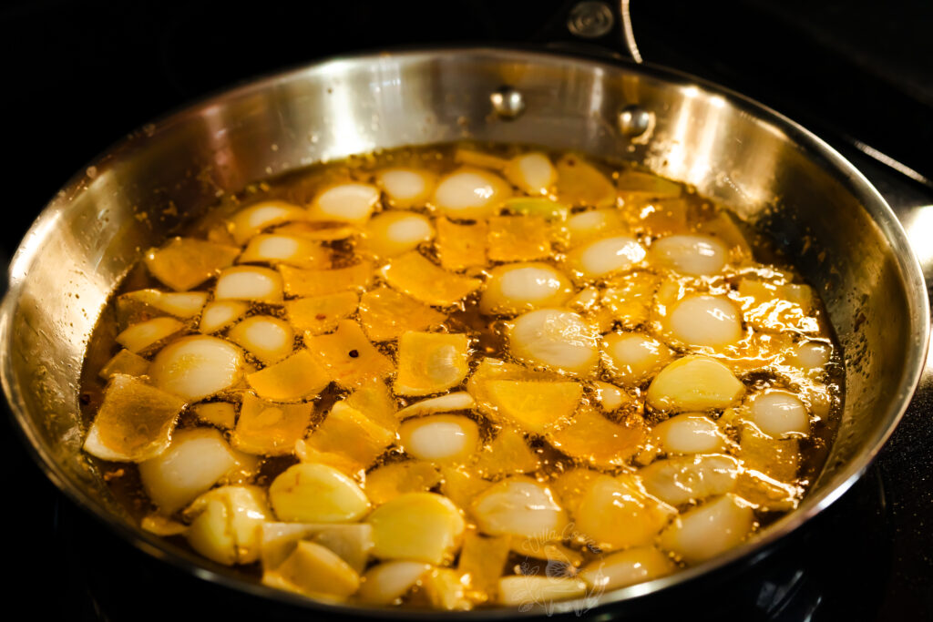 chili oil being prepared for a tacos al vapor recipe.