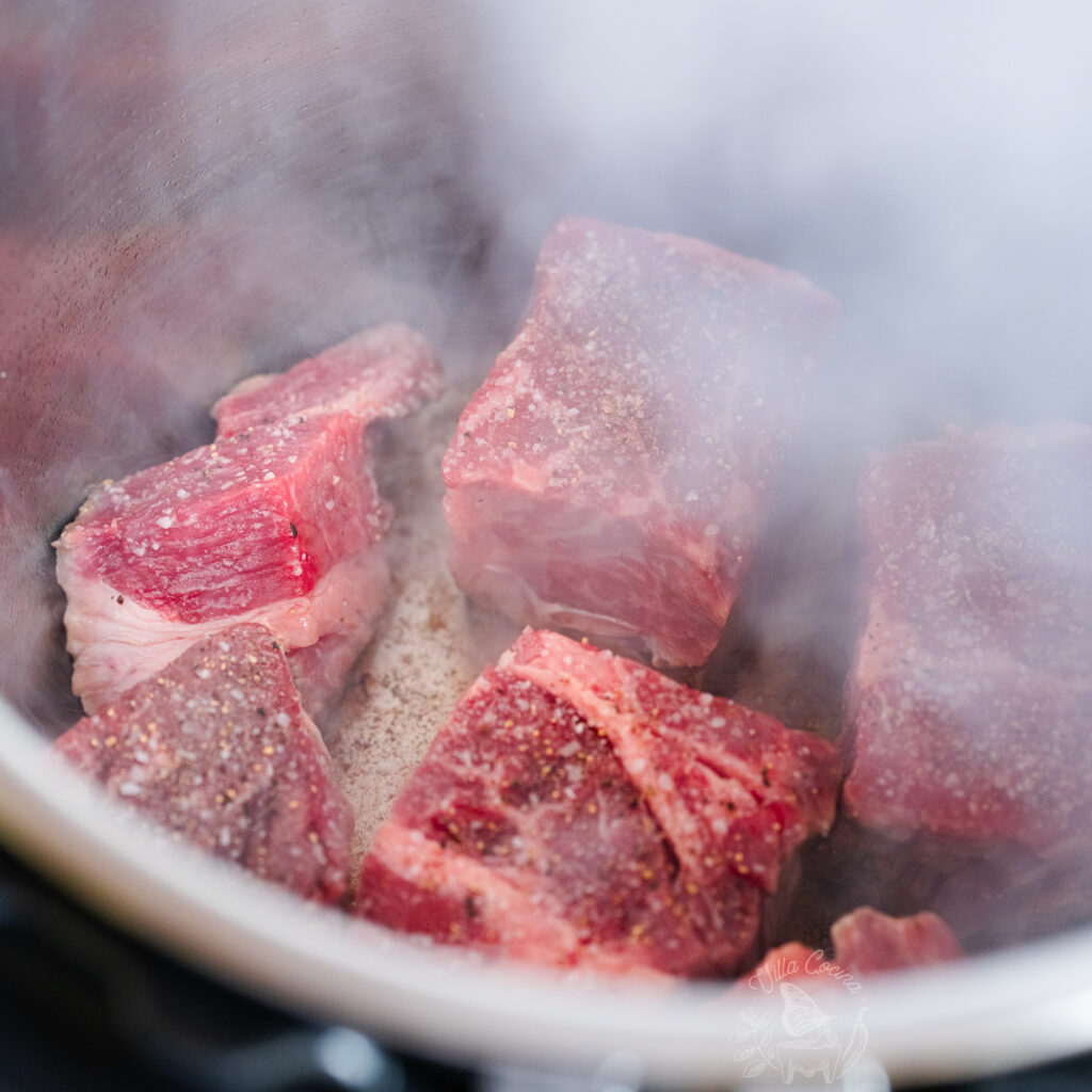 Beef chuck roast being seared prior to cooking on an instant pot.