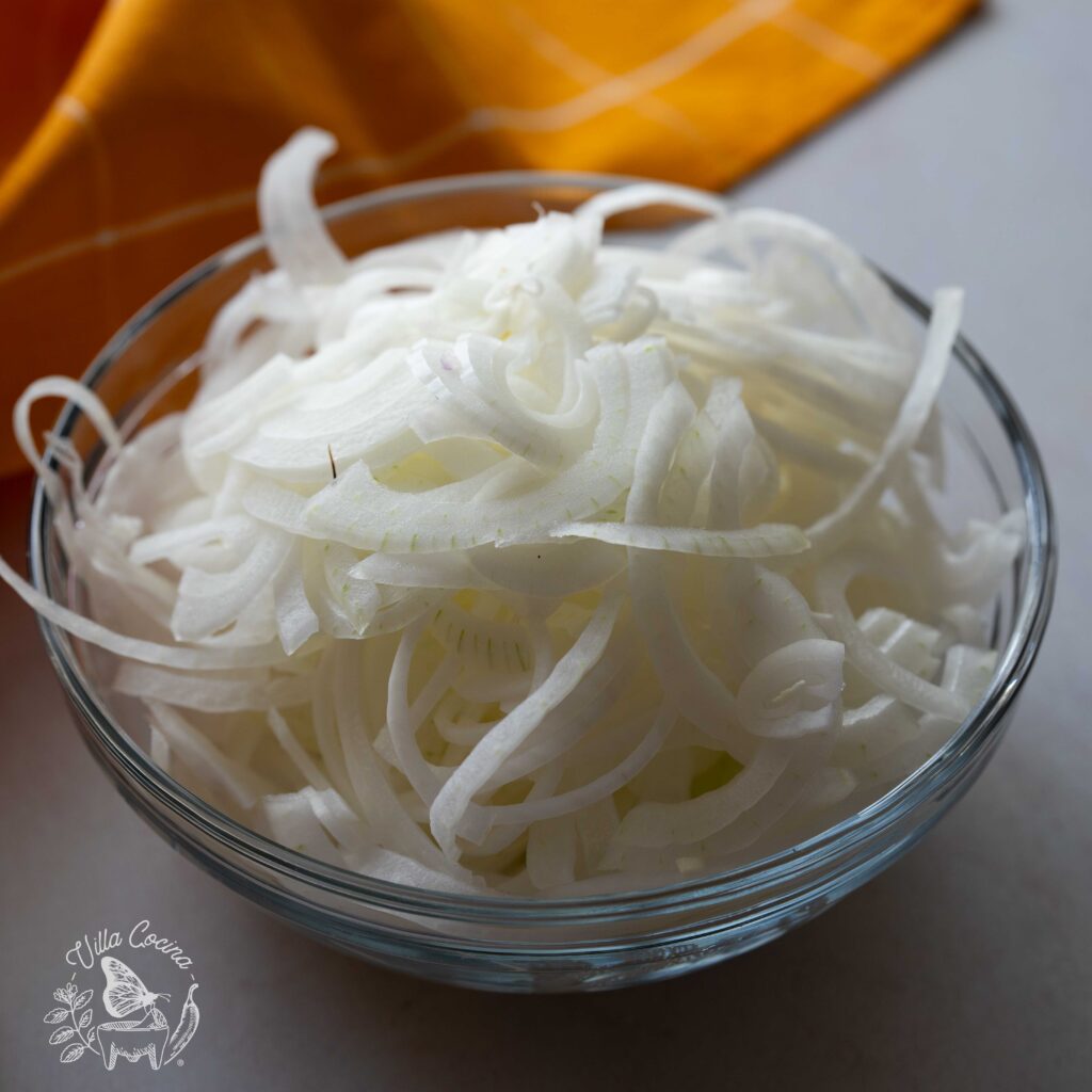 A bowl with white onions.