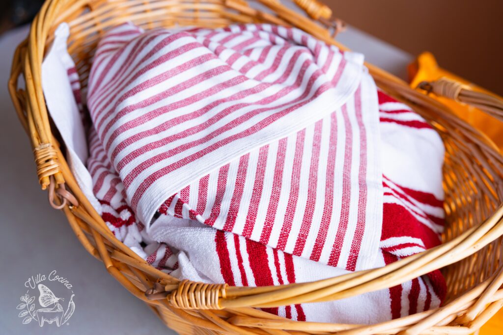 tacos in a basket already covered with layers to keep them warm