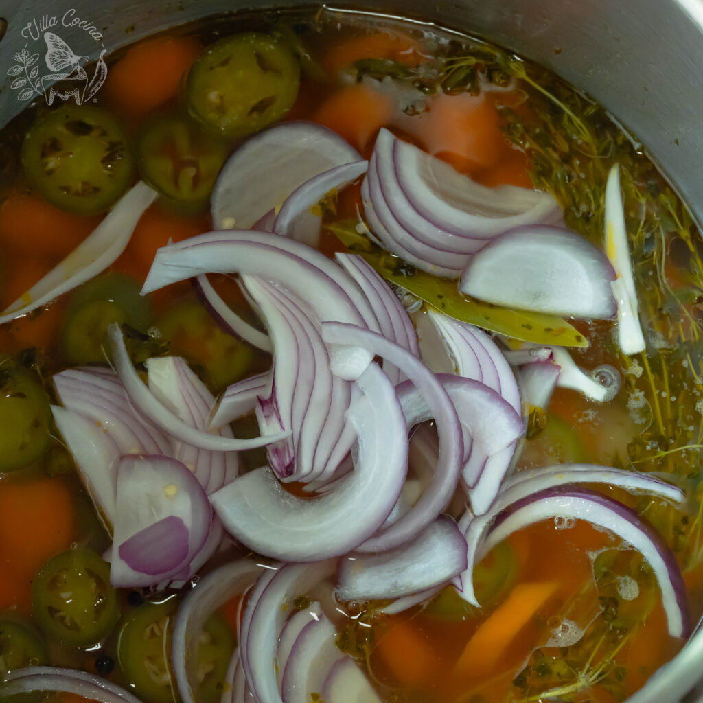 Purple onion added to the pickled carrots