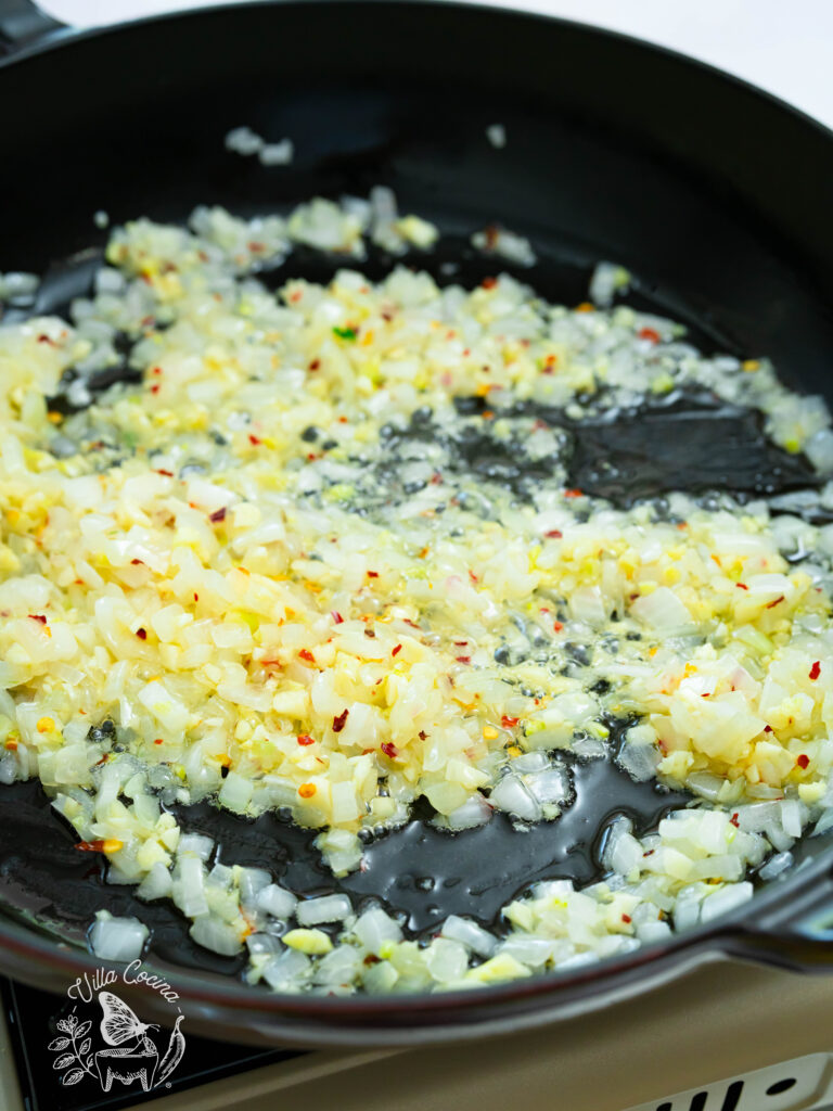 Sauté the onion, garlic, and chili flakes