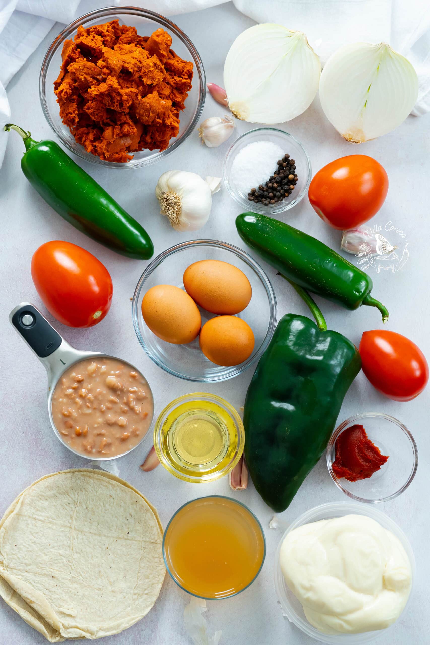 Ingredients for huevos rancheros casserole displayed.