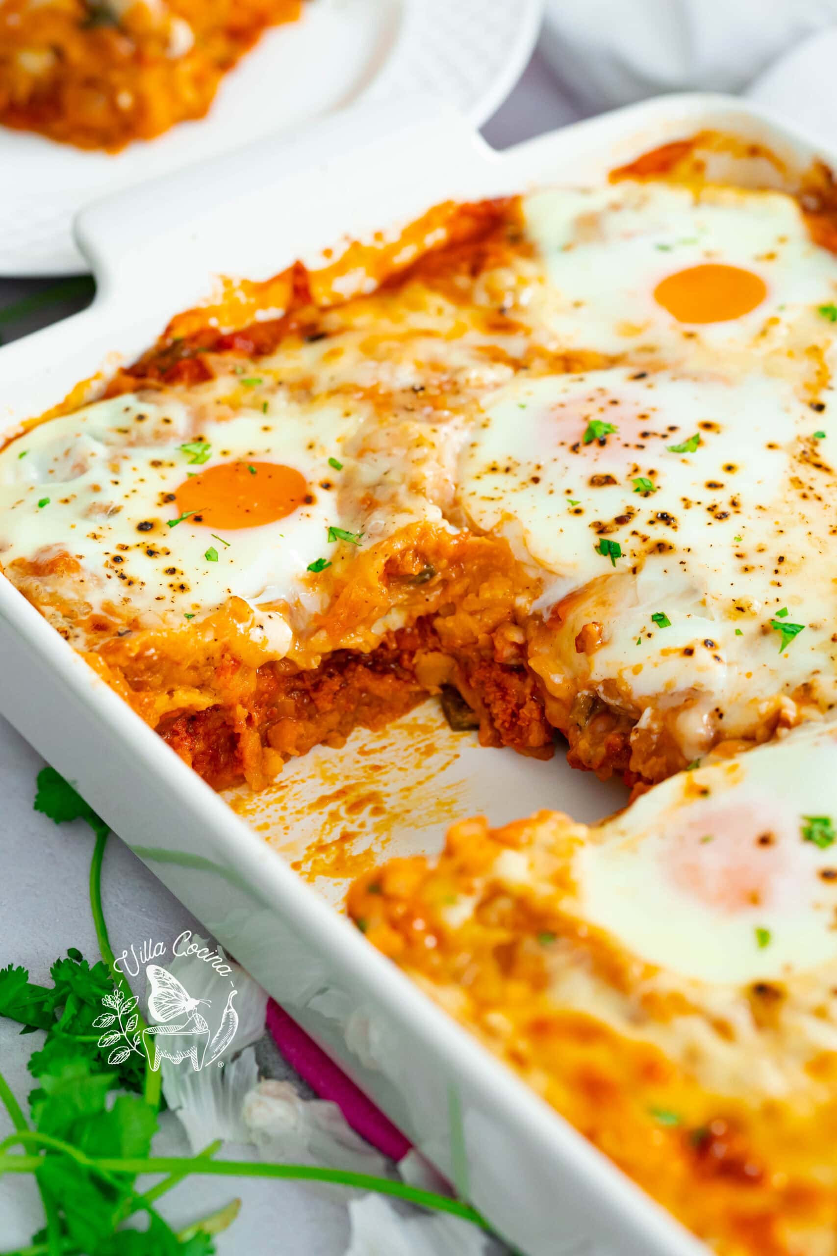 Huevos rancheros casserole with one piece removed.