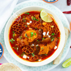 Instant Pot menudo, tender and hot, topped with classic Mexican garnishes.