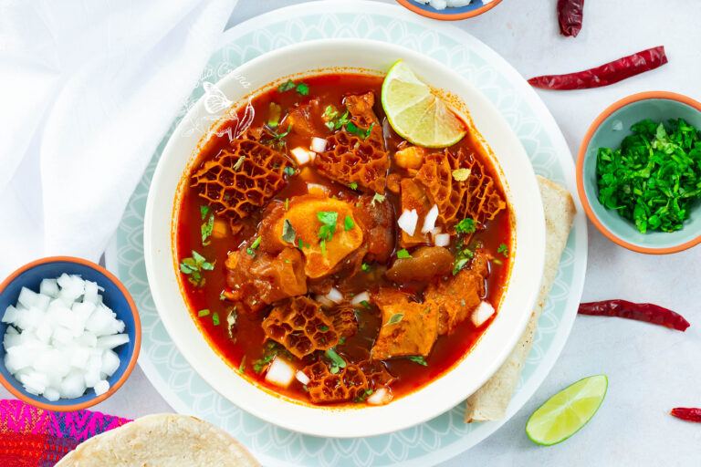 Instant Pot menudo, tender and hot, topped with classic Mexican garnishes.