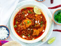 Instant Pot menudo, tender and hot, topped with classic Mexican garnishes.