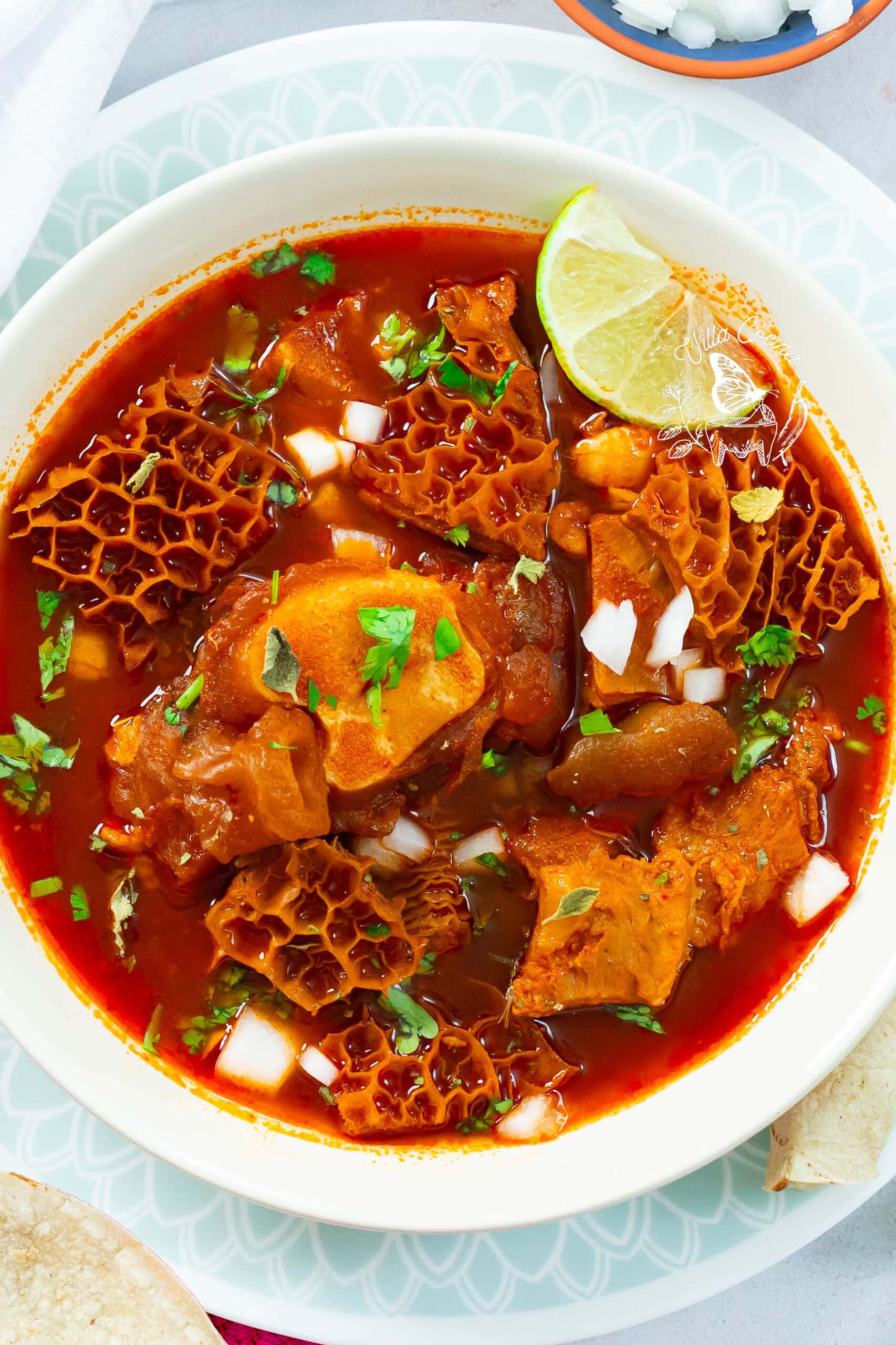 Instant Pot menudo, tender and hot, topped with classic Mexican garnishes.