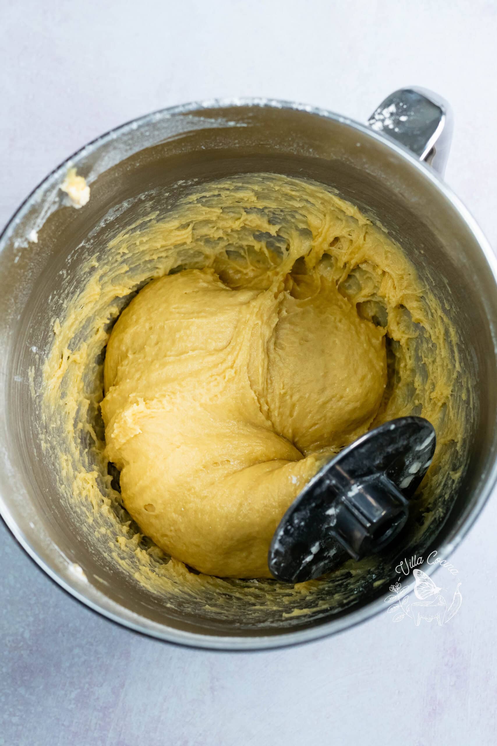 Soft concha dough in a mixer bowl with the dough hook.