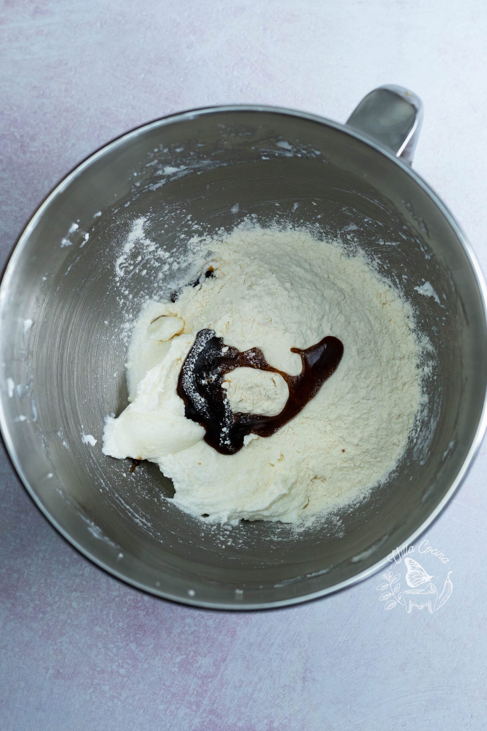 Flour and vanilla bean paste added to creamed shortening and sugar.
